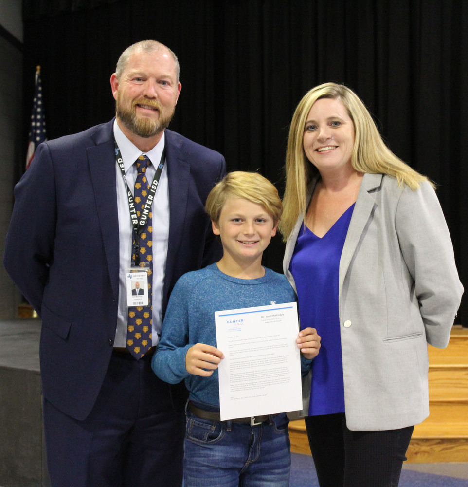 student with principal and supt.