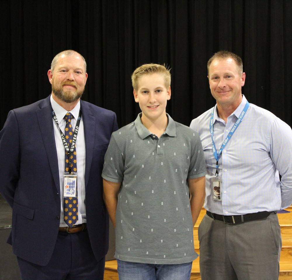 student with principal and supt